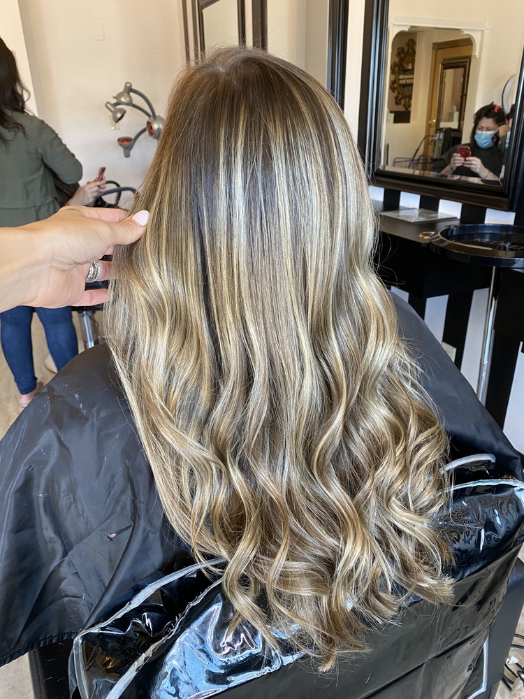 Long blonde balayage blowout styled in the studio